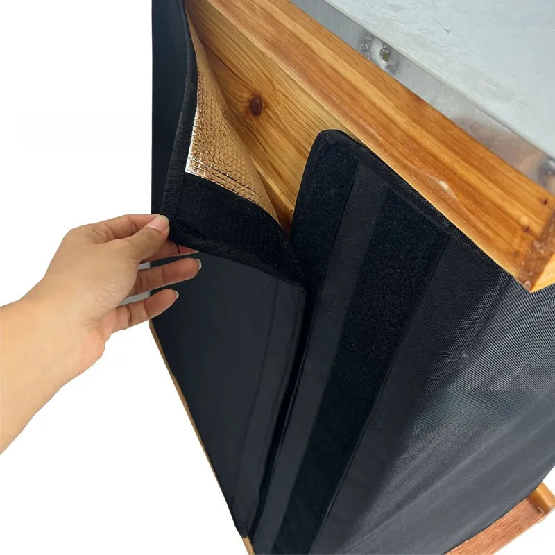 Hand opening the original wrap’s hook-and-loop overlap.